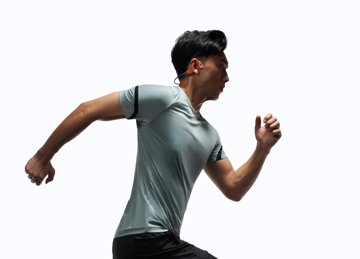 People wearing Shokz OpenSwim Pro while running