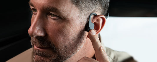 Man wearing AfterShokz Air lifestyle-endurance headphones