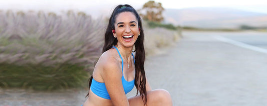 Runner Kim Clark wearing AfterShokz Aeropex wireless headphones