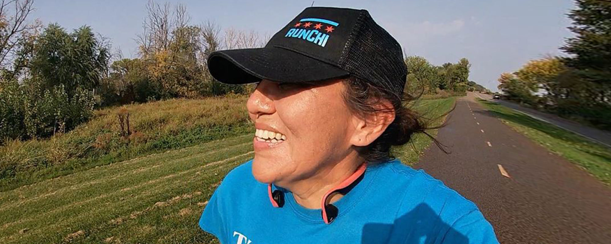 Navajo runner Verna wearing AfterShokz headphones while running