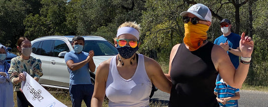 Kristen (left) and AfterShokz VP Kim Fassetta (right) after crossing the virtual race finish line