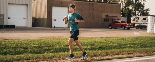 Outside Safe Space founder Mikah Meyer running across Minnesota wearing AfterShokz